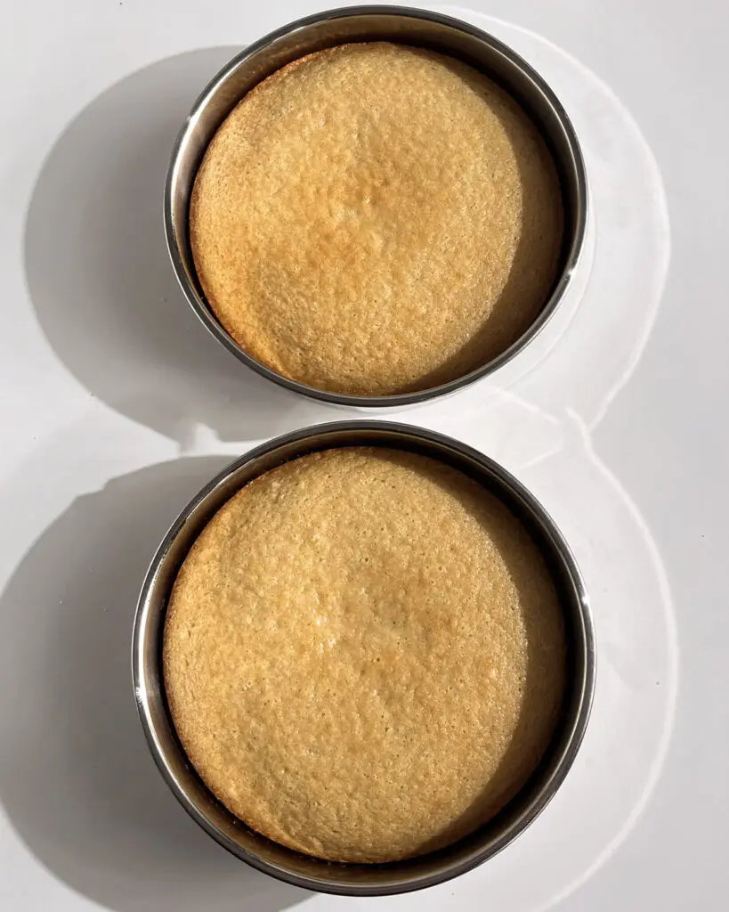 coconut white chocolate layer cake eggless on a plate
